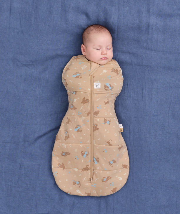 TOG-rated newborn swaddle from ergoPouch, made from organic, breathable materials to support safe and quality sleep.