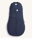 Product shot of a dark blue ergoPouch 2.5 TOG Cocoon Swaddle Bag, featuring a front zipper and a cozy padded design.