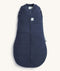 Product shot of a dark blue ergoPouch 2.5 TOG Cocoon Swaddle Bag, featuring a front zipper and a cozy padded design.