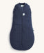 Product shot of a dark blue ergoPouch 2.5 TOG Cocoon Swaddle Bag, featuring a front zipper and a cozy padded design.