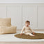 Toddler wearing an ergoPouch Long Sleeve Layer 1.0 TOG Vanilla