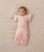 Newborn wearing ergoPouch Butterfly Cardi Daisies