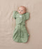 Newborn wearing ergoPouch Butterfly Cardi Willow Base and a matching Pouch in Willow