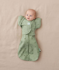 Newborn wearing ergoPouch Butterfly Cardi Willow and a matching Pouch