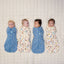 Four newborn babies asleep in ergoPouch Cocoon Swaddle Bag 0.2 TOG in Petit Pretzel and Bon Appetit