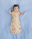 Newborn wearing an ergoPouch Cocoon Swaddle Bag 1.0 TOG Birthday Blobs with arms out