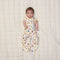 Baby with two arms out of ergoPouch Cocoon Swaddle Bag 1.0 TOG in Bon Appetit