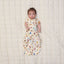 Baby with two arms out of ergoPouch Cocoon Swaddle Bag 1.0 TOG in Bon Appetit