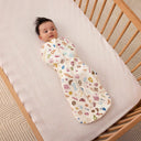 Baby being swaddled in ergoPouch Cocoon Swaddle Bag 1.0 TOG in Bon Appetit