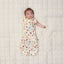 Baby transitioning to arms out sleeping with one arm out of ergoPouch Cocoon Swaddle Bag 1.0 TOG in Bon Appetit