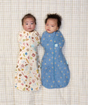 Babies wearing an ergoPouch cocoon swaddle that is made from organic, breathable materials.