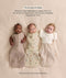 Three babies lying side-by-side demonstrating the three ways to wear the Cocoon Swaddle Bag: Arms Out, Arms In, and Hands Up with a Butterfly Cardi overlay.