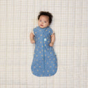 Newborn with both arms out of a ergoPouch Cocoon Swaddle Bag 0.2 TOG in Petit Pretzel