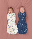 Two babies swaddled in ergoPouch Cocoon Swaddle Bag Daydream and Starbeam, to mimic the wound