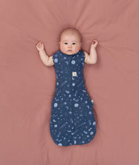 Baby transitioned to arms out sleeping easily with the ergoPouch Cocoon Swaddle Bag 1.0 TOG Starbeam