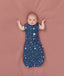 Baby transitioned to arms out sleeping easily with the ergoPouch Cocoon Swaddle Bag 1.0 TOG Starbeam