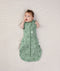 Newborn wearing an ergoPouch Cocoon Swaddle Bag 1.0 TOG Sweet Orchard with arms out