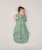 Newborn wearing an ergoPouch Cocoon Swaddle Bag 1.0 TOG Sweet Orchard with one arm out