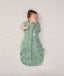 Newborn wearing an ergoPouch Cocoon Swaddle Bag 1.0 TOG Sweet Orchard with one arm out