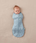 Newborn wearing an ergoPouch Cocoon Swaddle Bag 1.0 TOG Dragonflies