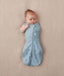 Newborn wearing an ergoPouch Cocoon Swaddle Bag 0.2 TOG Dragonflies with one arm out