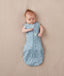 Newborn wearing an ergoPouch Cocoon Swaddle Bag 0.2 TOG Dragonflies with arms out