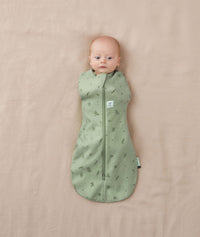 Newborn wearing an ergoPouch Cocoon Swaddle Bag 0.2 TOG Willow