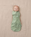 Newborn wearing an ergoPouch Cocoon Swaddle Bag 0.2 TOG Willow