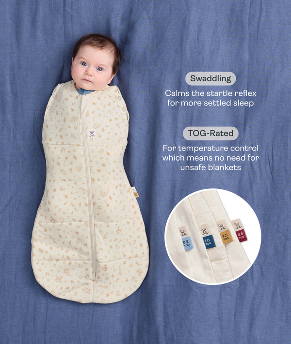 Baby wrapped in a Cocoon Swaddle Bag 2.5 TOG Lullaby with text highlighting swaddling benefits and TOG rating features.