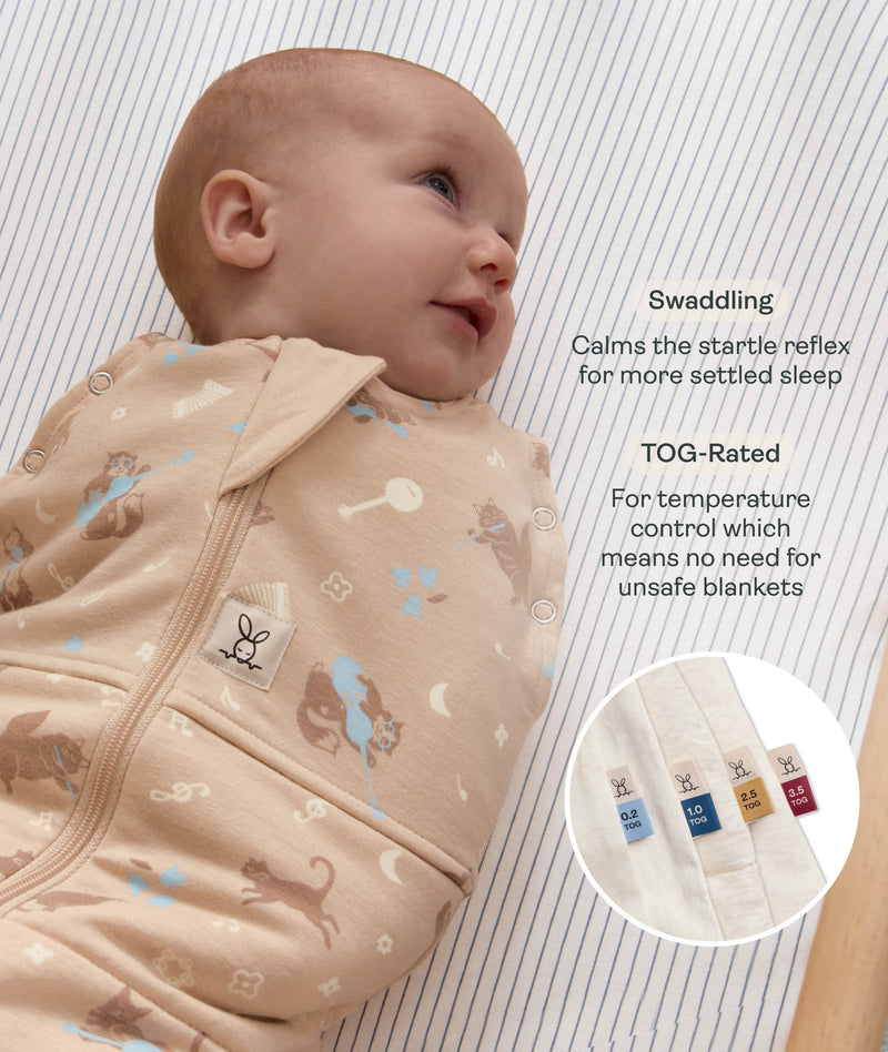 Smiling baby wrapped in a tan patterned Cocoon Swaddle Bag with text highlighting swaddling benefit and TOG rating feature.