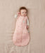 Newborn wearing an ergoPouch Cocoon Swaddle Bag 2.5 TOG Daisies with arms out
