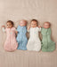 Four babies in ergoPouch Cocoon Swaddle Bag 2.5 TOG in their heritage colours Dasies, Dragonflies, Oatmeal Marle and Willow