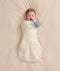 Baby wearing a Cocoon Swaddle Bag 2.5 TOG Lullaby with one arm out