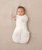 Newborn wearing an ergoPouch Cocoon Swaddle Bag 3.5 TOG Oatmeal Marle with one arm out