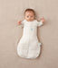 Newborn wearing an ergoPouch Cocoon Swaddle Bag 3.5 TOG Oatmeal Marle with arms out