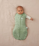 Newborn wearing an ergoPouch Cocoon Swaddle Bag 2.5 TOG Willow with one arm out