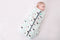 Baby wearing a Cocoon Swaddle Bag 2.5 TOG Clouds