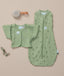 ergoPouch Butterfly Cardi Willow Base next to a matching Pouch in Willow and White Noise Machine
