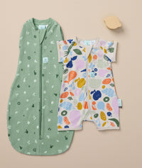 Flatlay of Cocoon Swaddle Bag 1.0 TOG Sweet Orchard and a Short Sleeve  Layer Fruit Salad