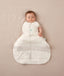 Newborn wearing an ergoPouch Hip Harness Cocoon Swaddle Bag 2.5 TOG Oatmeal Marle with one arm out