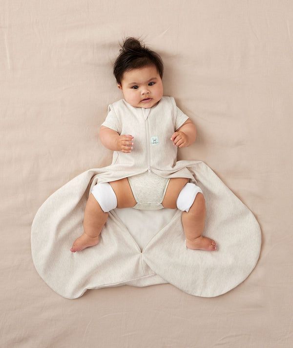 Baby with hip dysplasia wearing ergoPouch Hip Harness Jersey Sleep Bag 0.2 TOG Oatmeal Marle
