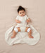 Baby with hip dysplasia wearing ergoPouch Hip Harness Jersey Sleep Bag 0.2 TOG Oatmeal Marle