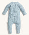 The back view of the ergoPouch Long Sleeve Layer is shown in blue with dragonfly prints.