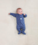 Newborn baby wearing an ergoPouch Long Sleeve Layer 0.2 TOG Night Sky