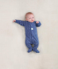 Newborn baby wearing an ergoPouch Long Sleeve Layer 0.2 TOG Night Sky