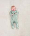 Newborn baby wearing an ergoPouch Long Sleeve Layer 0.2 TOG Sage