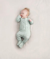 Newborn baby wearing an ergoPouch Long Sleeve Layer 0.2 TOG Sage