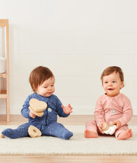 Baby wearing a lightweight ergoPouch Long Sleeve Layer 0.2 TOG Berries