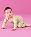 Baby wearing an ergoPouch Long Sleeve Layer 1.0 TOG Birthday Blobs