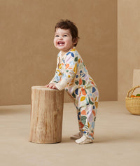 Baby wearing an ergoPouch Long Sleeve Layer 1.0 TOG Fruit Salad